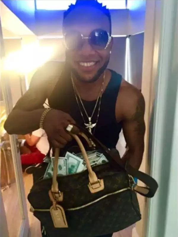 Keep talking while I keep balling - Kcee as he shows off bag of cash